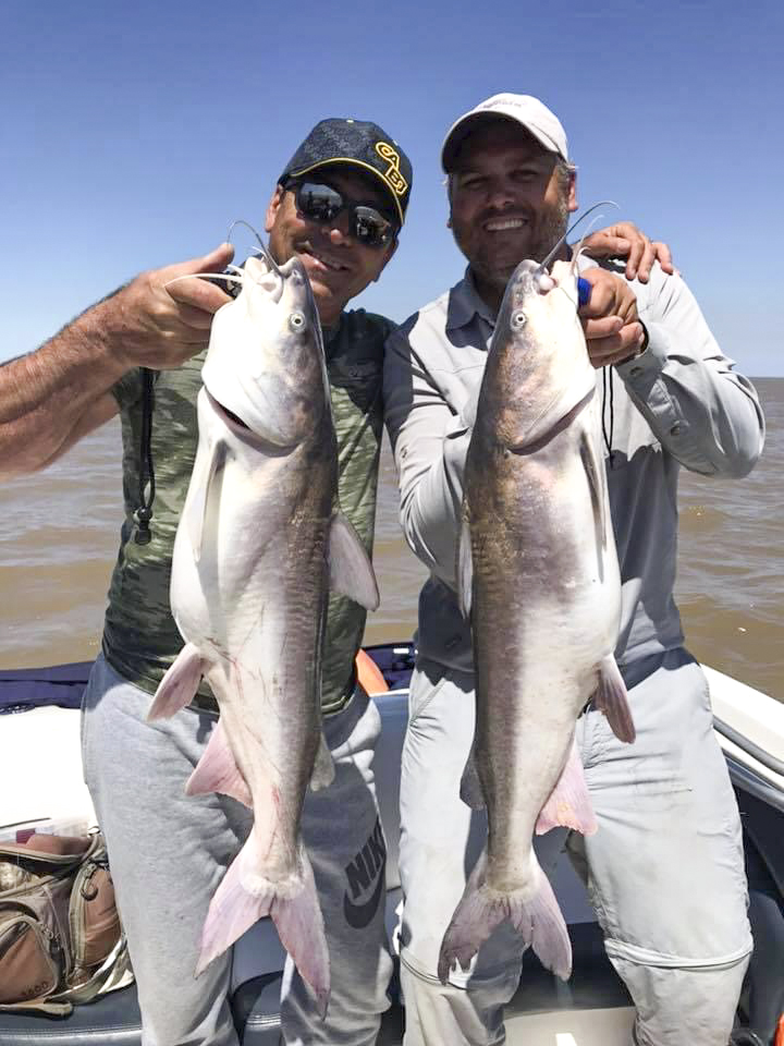 Lucas (Right) and a client (Left). with 2 Rio de la Plata average SeaCatfish